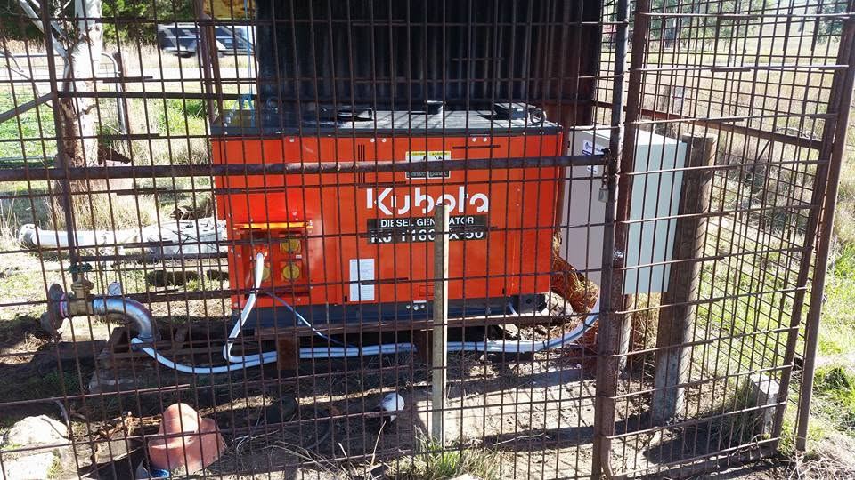 Kubota diesel-driven pump unit in a protective cage