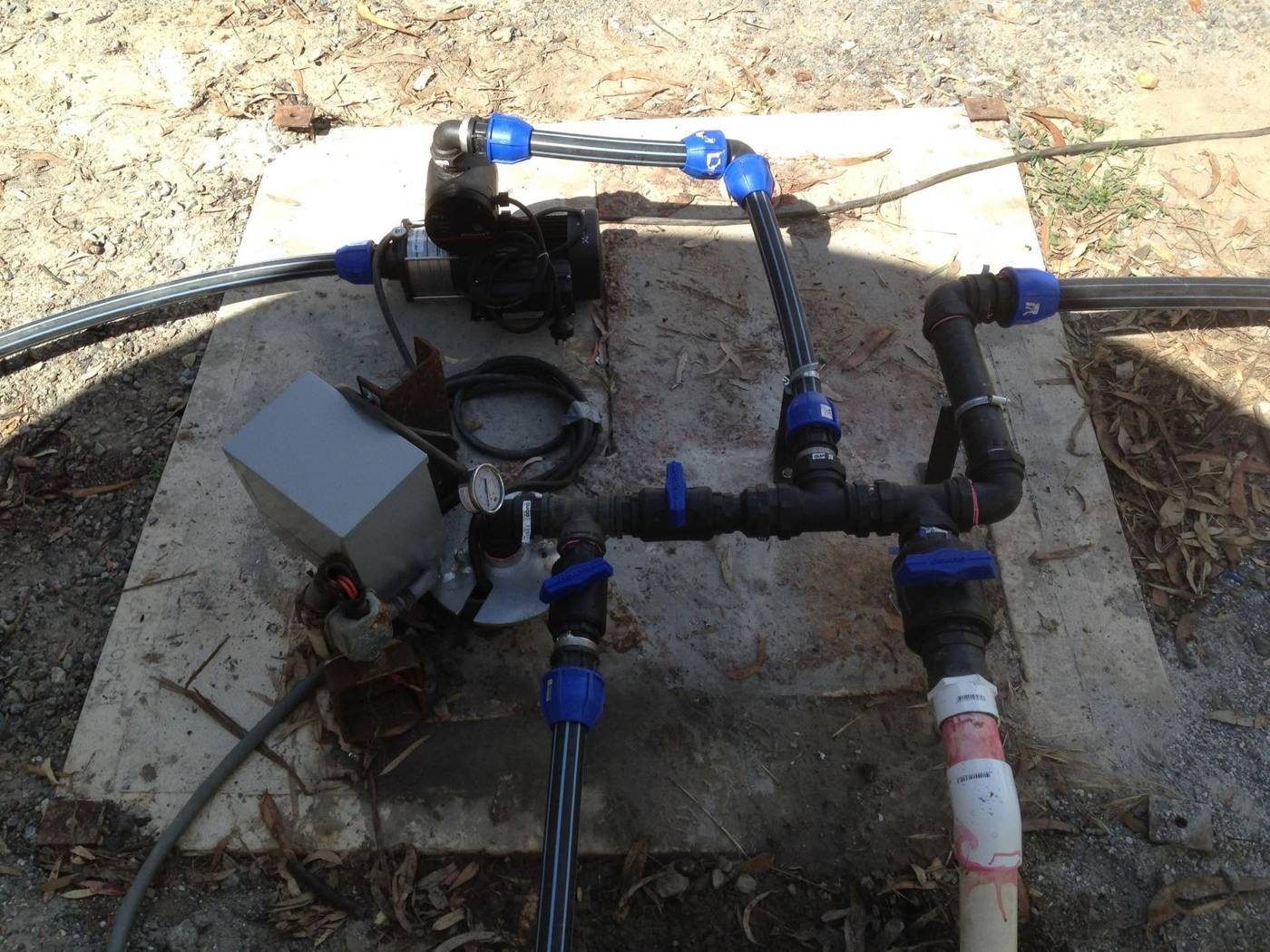 Irrigation pump manifold and pipework on a concrete pad
